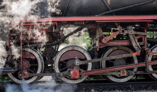 old-locomotive-wheels-historical-steam-train-passes-through-deciduous-forest